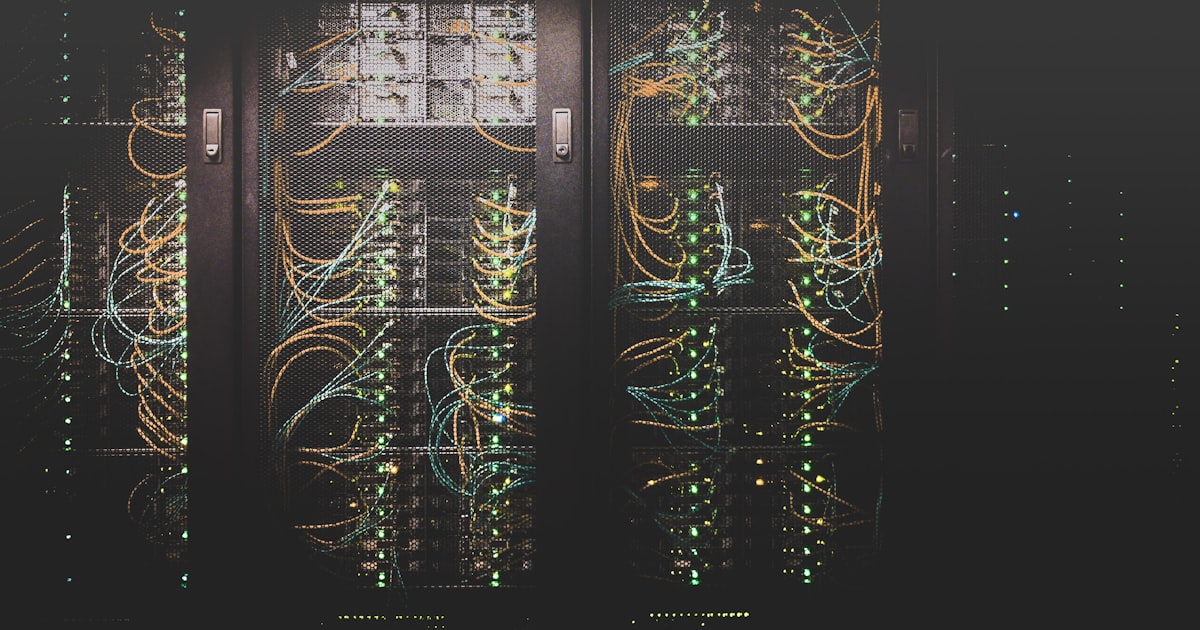 Dense tangle of colored ethernet cables connecting network switches — representing the infrastructure behind shared free hosting
